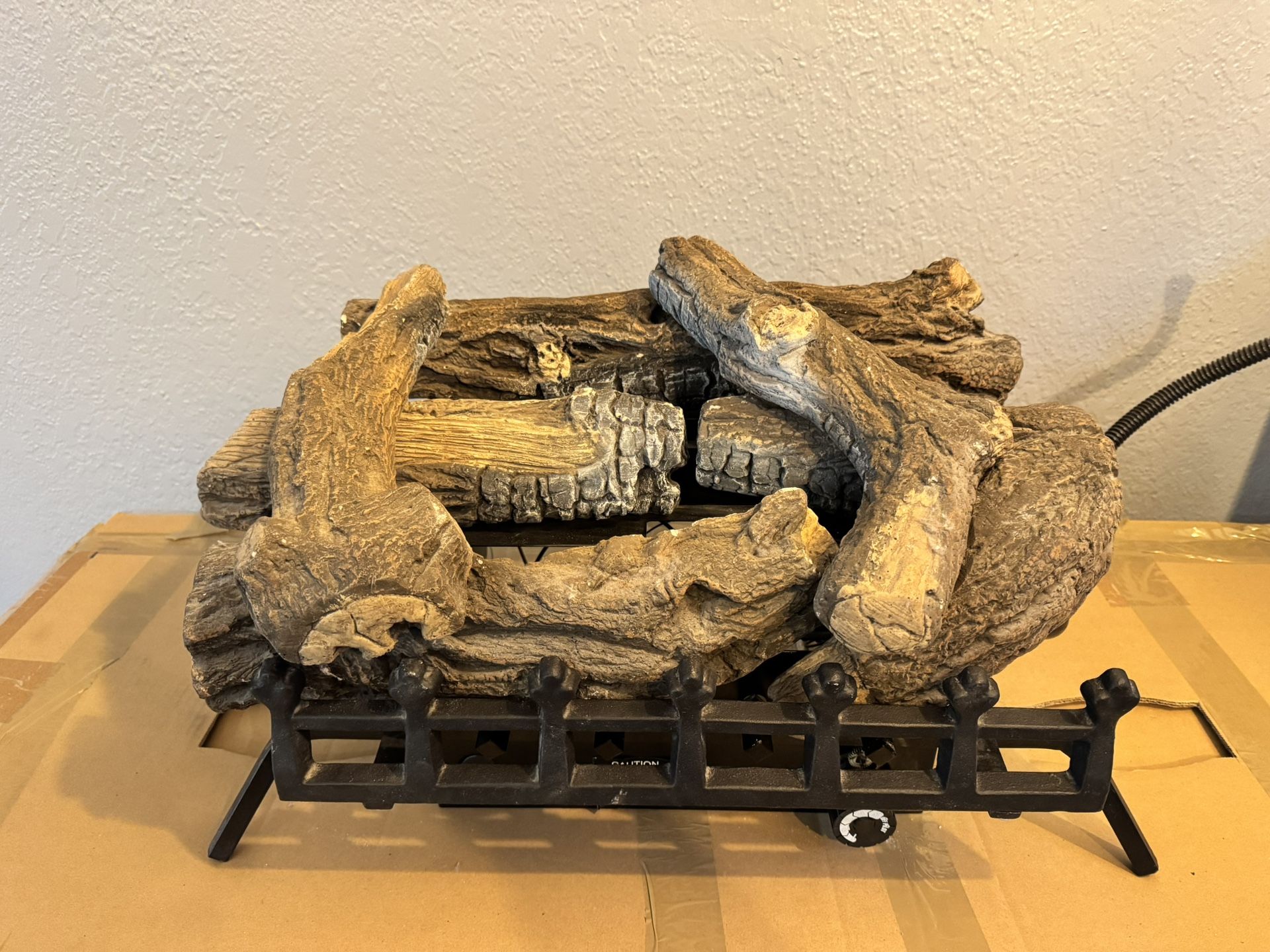 Natural gas fireplace insert with logs.