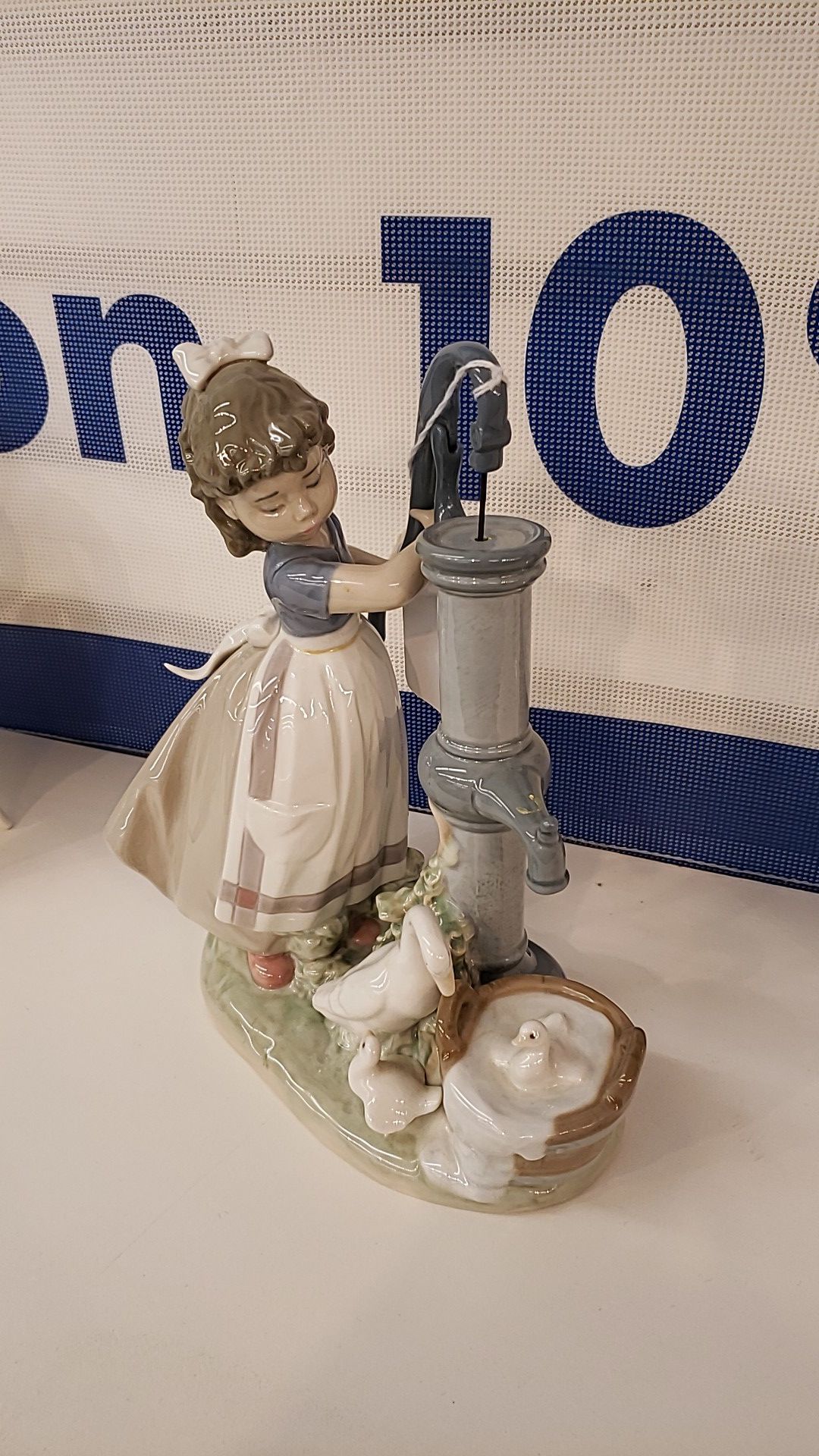 Lladro figurine girl pumping water
