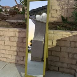 Tall standing wood framed mirror