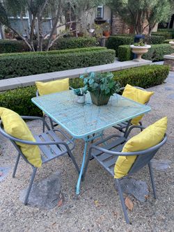 Patio Table + 4 Chairs + pillows and plants