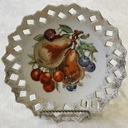 Vintage hand-painted wall hanging ceramic lattice-edge plate with fruit motif. 8”