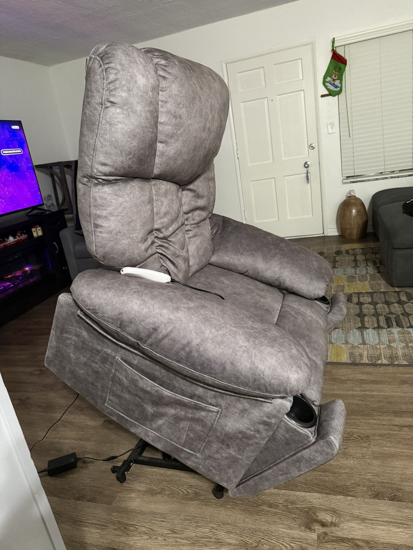 Reclining armchair with lift function, massage and heating.