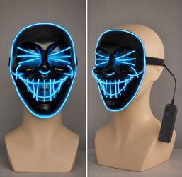 Spirit Halloween LED Purge-style mask featuring glowing blue neon wire outlining a menacing smile an
