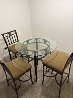 Very nice Bar table with bar chairs. Side table as well.