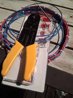 Wire cutters and strippers with assorted connectors and wire