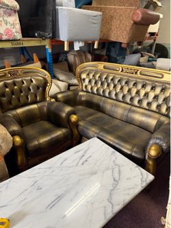 Beautiful baroque-style leather couch and chair set