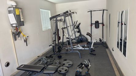 Marcy Home Gym Full Equipment Set plus elliptical plus extra bench plus hundreds of pounds of weight plus adjustable dumbbells an entire home gym