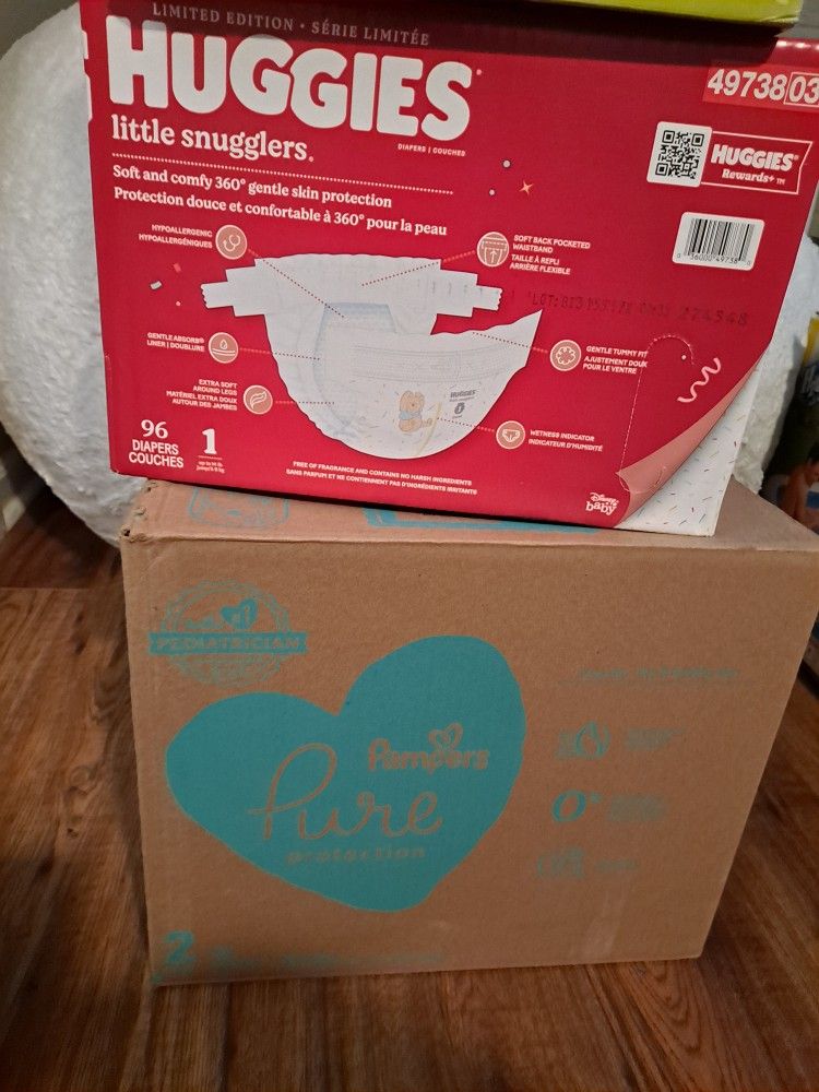2 Boxes Of Diapers.
