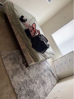Queen bed and rug