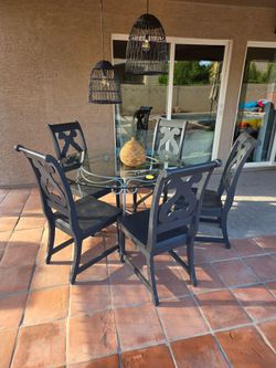 5 heavy duty chairs and glass table
