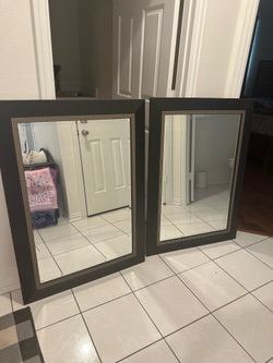Two 34x43 black framed mirrors