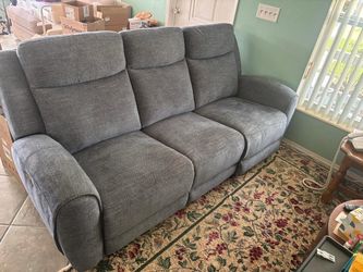 Three seat navy blue sofa with two end recliner.. 84” wide,30” depth, 40” high