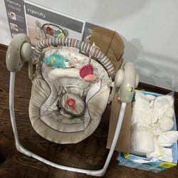 Portable Swing And 65 Born Pampers