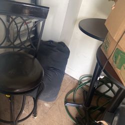 Two bar tables and chairs