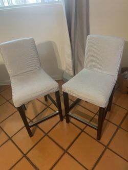 IKEA BERGMUND bar stool with a blue and white pinstripe cover