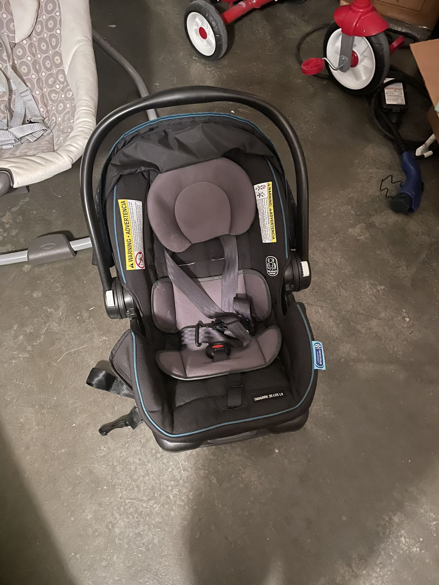 Graco Snugride 35 Lite LX Baby Car Seat, Graco Baby Swing And Two Other Baby Chairs