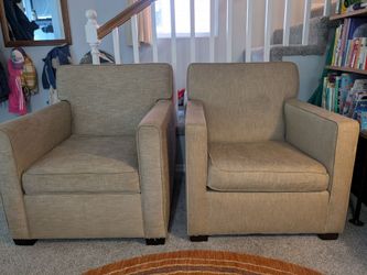 Two beige arm chairs