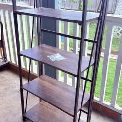 New ! Selling a modern 4-tier shelving unit in great condition. Black metal frame with dark wood shelves – very sturdy and stylish. Perfect for living