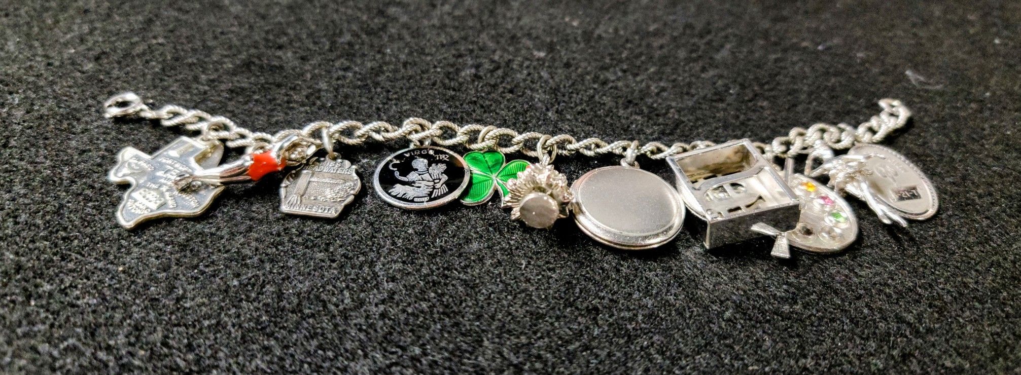 VINTAGE STERLING 12 CHARM WELLS CHARM 7" BRACELET WEIGHS 40.69 GRAMS  