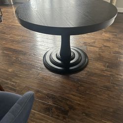 Crate & Barrel Aniston black round extension dining table