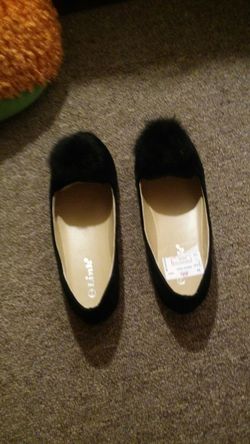 Brand new black flats with puff ball on front of toe. Made by link for girls size 2y paid $12 but will take $10
