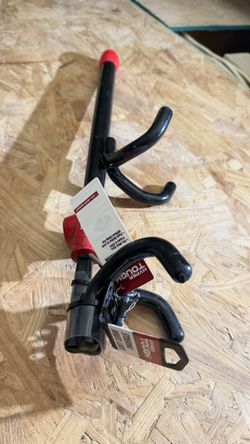 Hyper Tough Universal Steering Wheel Lock, designed to prevent vehicle theft by securing the steering wheel in place. 