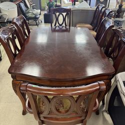 Vintage classic mahogany, cherry finish dining room table w/ 8 and is designed with traditional cabriole legs - 66” x 43”