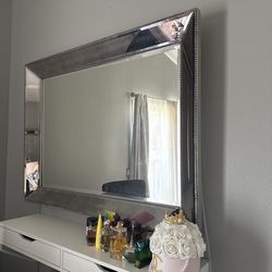 Queen size bed with two nightstands with a whole vanity set up and chair