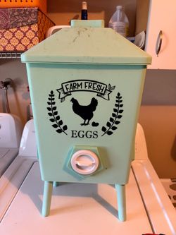 Plastic rustic automatic chicken feeder used as a garden