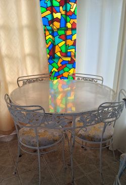 $100 Wrought iron table with chairs
