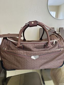 GUESS Brown Patterned Duffel Bag wheeled can be used as carry on