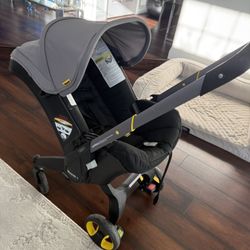 Doona Stroller, Base And Attaching Diaper Bag 