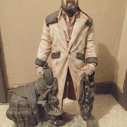 Statue Cowboy Standing With Saddle 