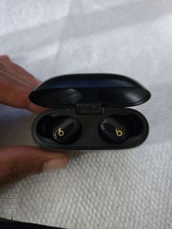 Gold and Black Beats Wireless Earbuds