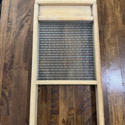 washboard with a wooden frame and a glass 