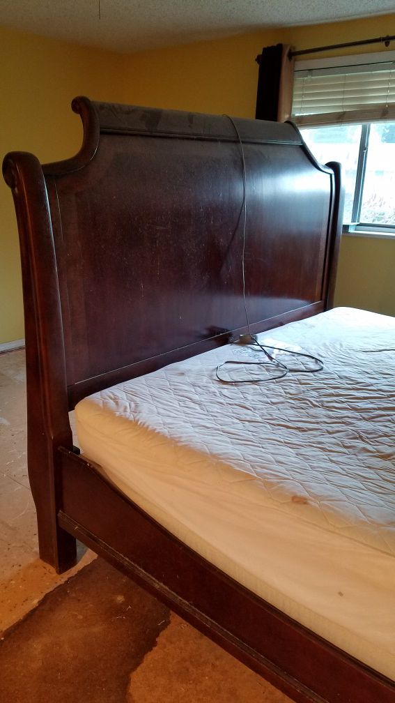 King size Ashley Furniture sleigh bed with dresser.