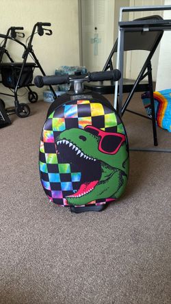 Dinosaur scooter luggage bag. Brand is Viggio