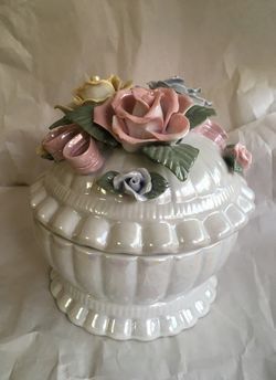 Large vintage porcelain trinket box with flowers on top