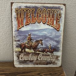 Metal cowboy sign