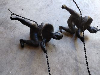 Bronze Man Wall Climbing Statues