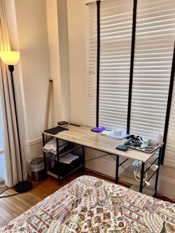 Wood-look desk with black storage shelves
