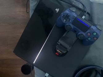 PLAYSTATION 4 and NAVY BLUE CONTROLLER WITH CHARGER STAND