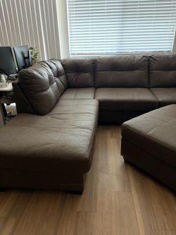 Brown pleather sectional w/ ottoman