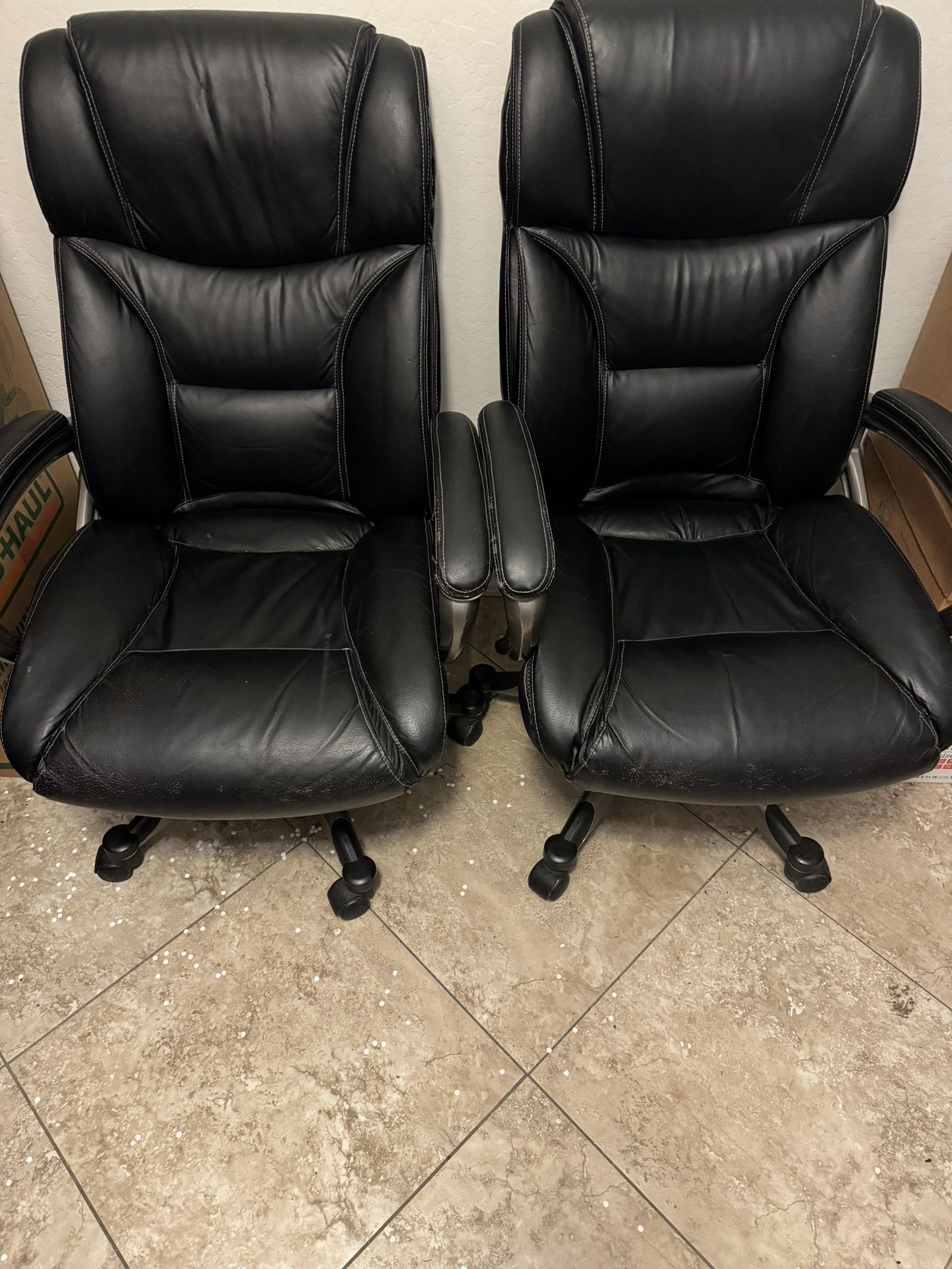 Two Black Leather Rolling Chairs