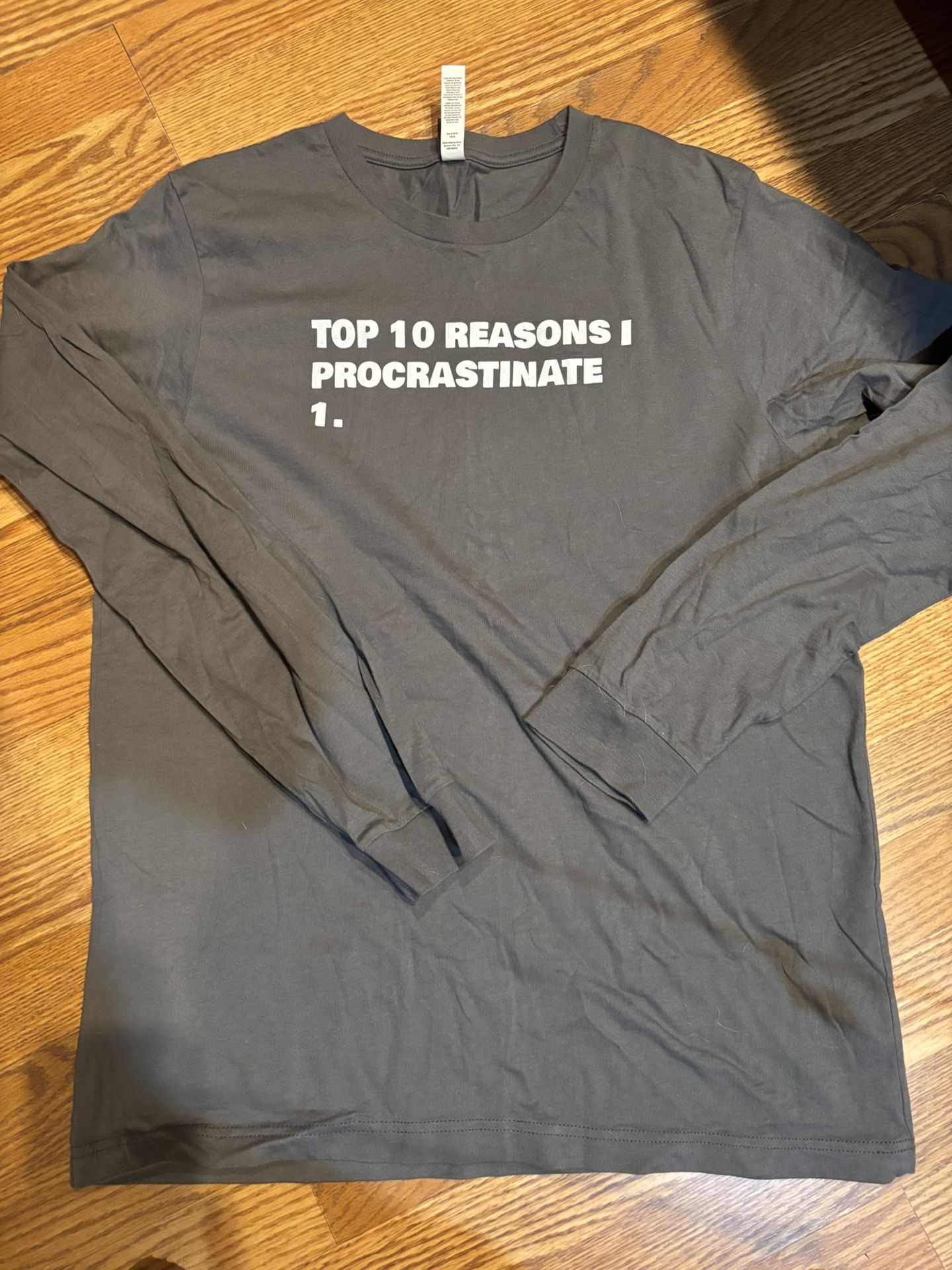 Long sleeve T shirt. Procrastinate  large 