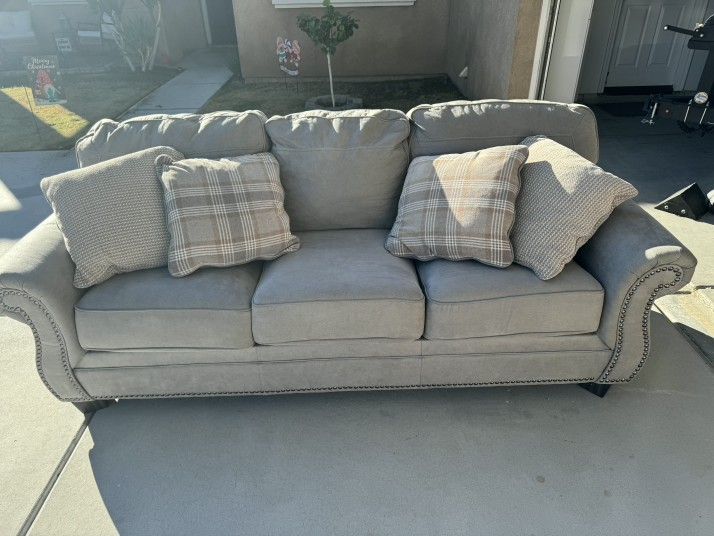 Gray sofa With 4 Pillows