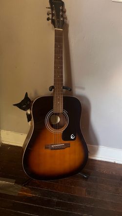 Acoustic guitar and stand
