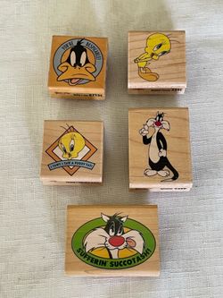 A set of 5 Wood mounted Looney Tunes character rubber stamps.
