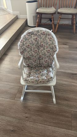Child’s white rocking chair