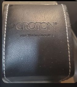 Brand new gorgeous croton ladies watch with small diamonds and box  ( never used ).  Needs battery